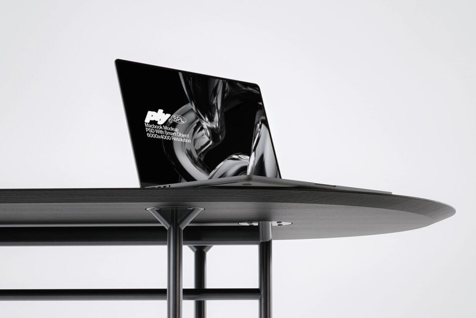 Side angle of blank macbook on contemporary dining setup