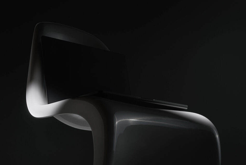 Modern black plastic chair with curved backrest studio product shot