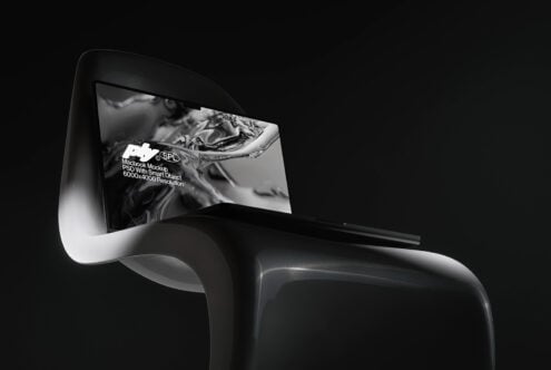 Macbook on modern chair with liquid metal texture on screen