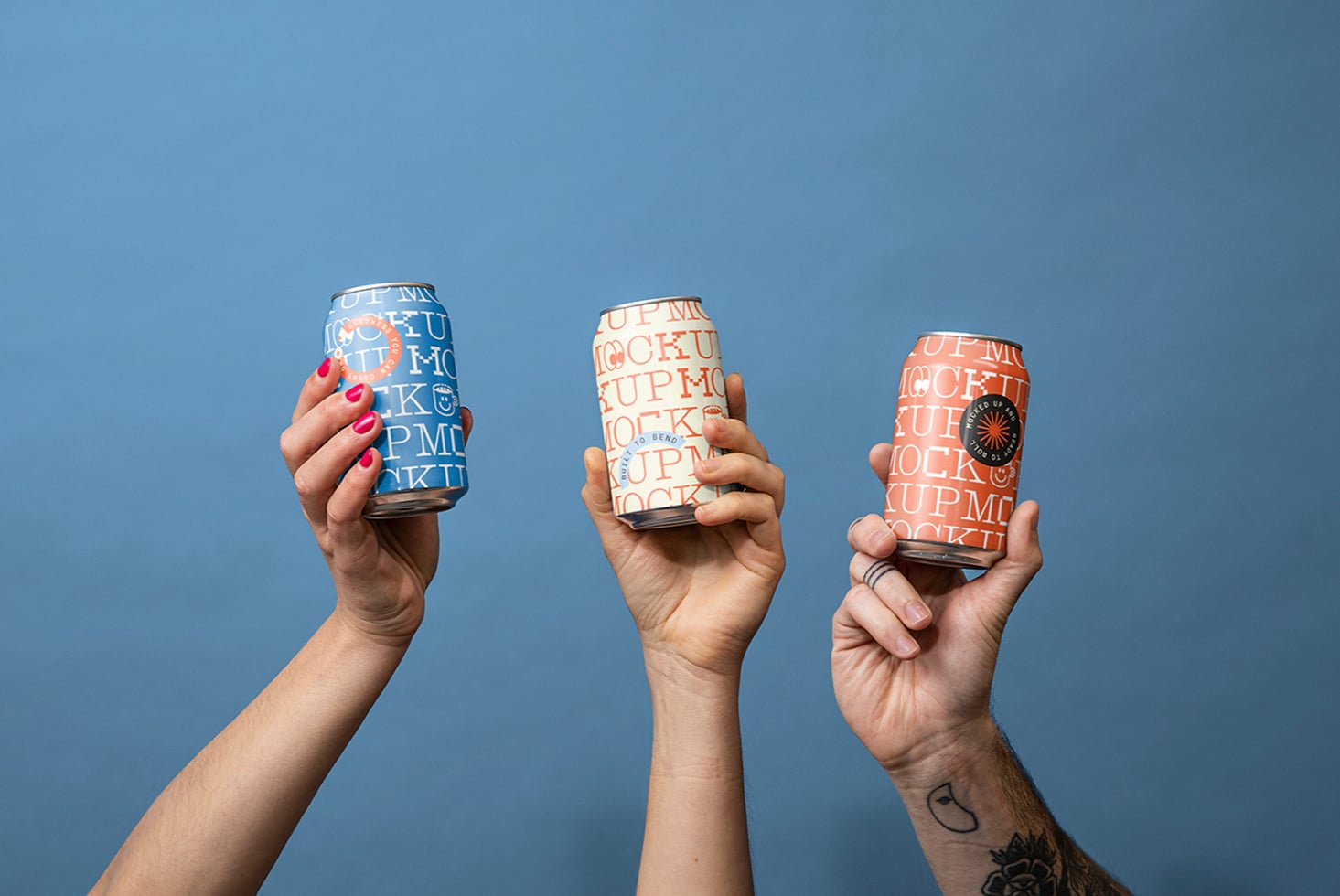 Three hands holding branded aluminum cans with text mockups against blue sky