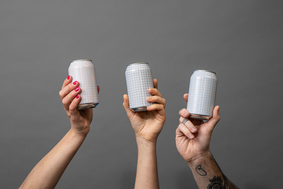 Three hands holding aluminum cans with grid pattern mockups
