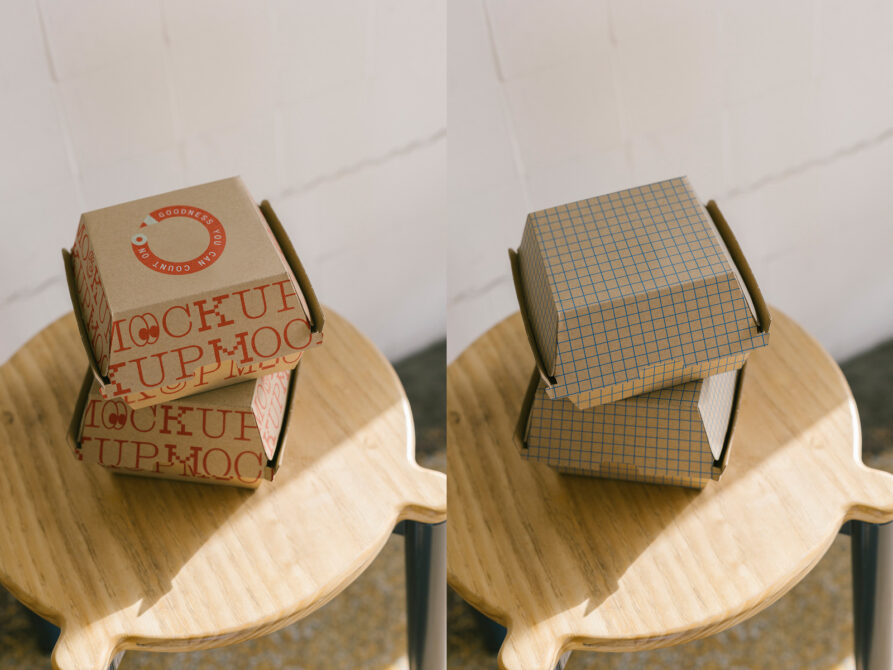 Side by side cardboard box mockups on wooden chair with patterns