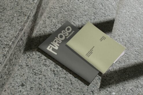 Gray mockup card with cream text next to pale yellow card on concrete