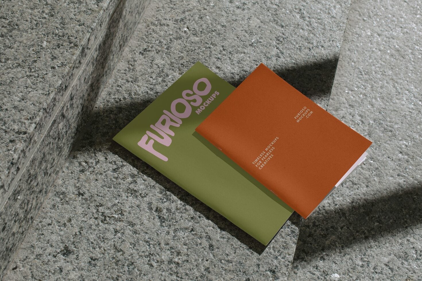 Olive green mockup card beside rust card on textured gray concrete