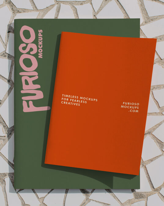 Green folder with pink Furioso text overlapping bright orange blank card