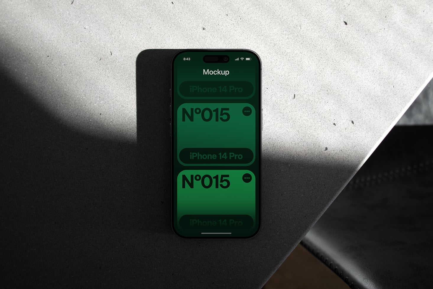 iPhone 14 Pro mockup with green screen showing N°015 design samples