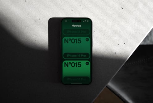 iPhone 14 Pro mockup with green screen showing N°015 design samples