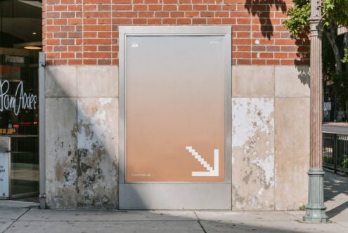 Street display screen with peachy gradient showing white pixel arrow in lower right