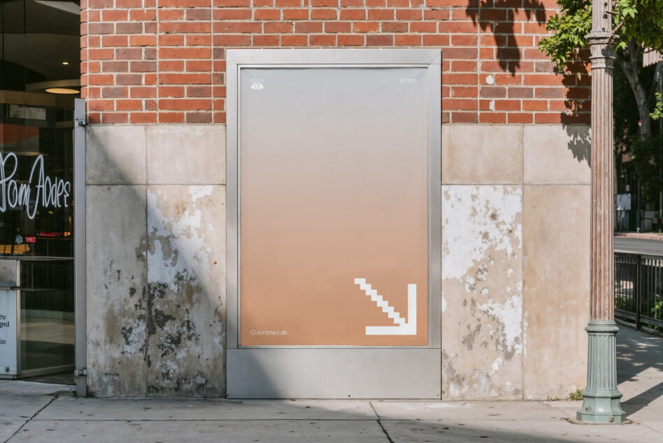 Street display screen with peachy gradient showing white pixel arrow in lower right