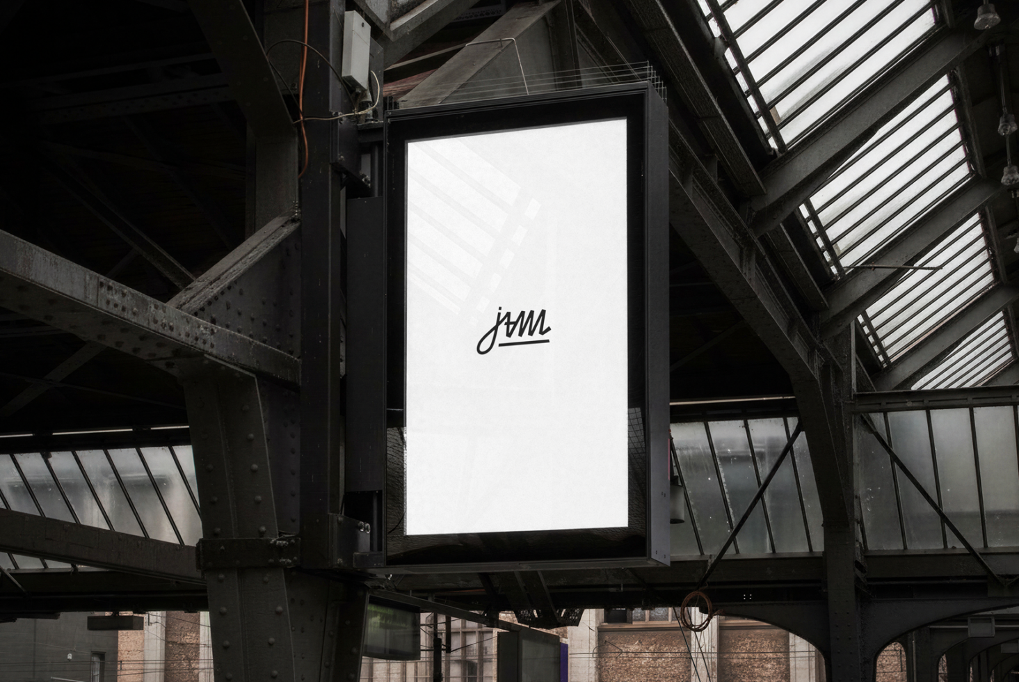 Blank billboard with jvmi logo in industrial underpass with metal beams