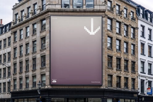 Corner billboard with mauve gradient, small white pixel icon in center
