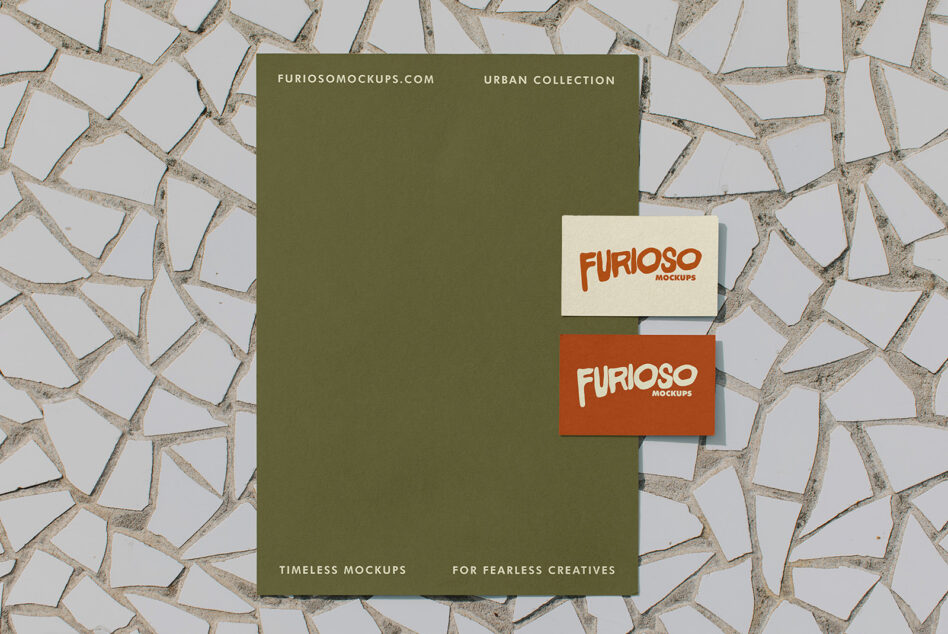Stationery set with business cards on olive poster flatlay