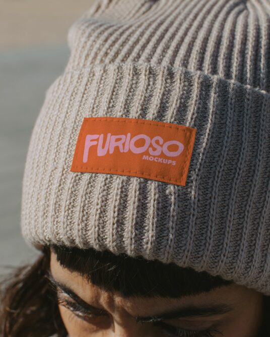 Burnt orange label with pink Furioso lettering sewn on cream ribbed beanie