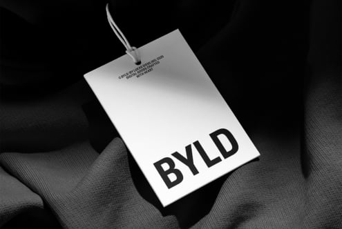 Clothing tag mockup with BYLD branding in monochrome
