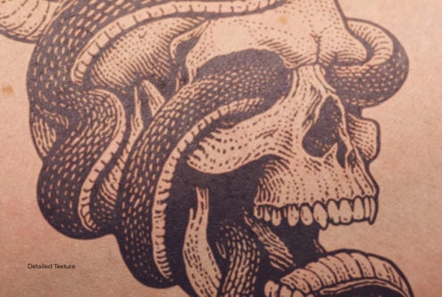Close up snake skull tattoo showing detailed stippled texture work