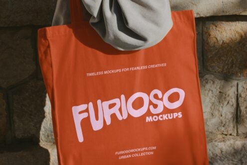 Bright orange tote bag with large pink FURIOSO logo worn over shoulder