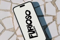 iPhone with white screen displaying Furioso Mockups black text vertically