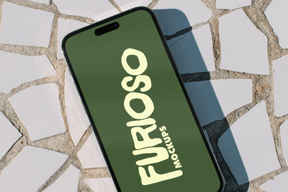 iPhone with green screen showing Furioso Mockups text in cream color