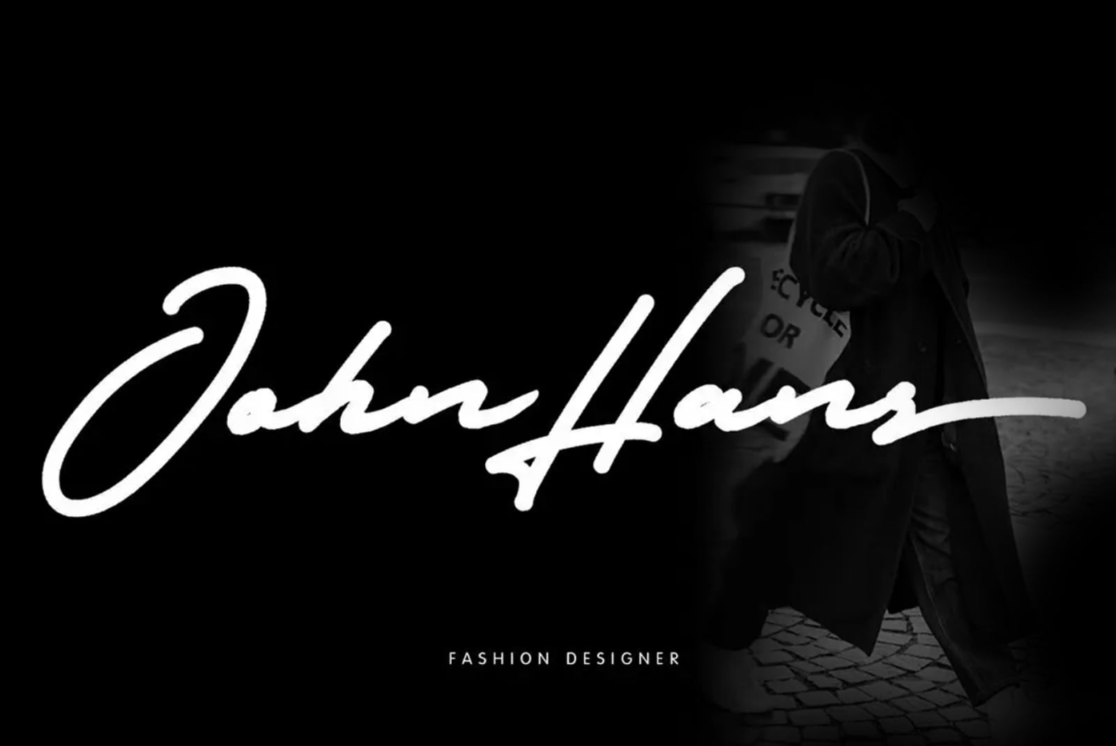 John Harris script signature over fashion designer clothing on mannequin