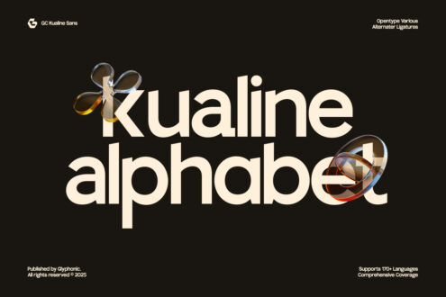 Kualine alphabet display with glass sphere decorative elements on dark background