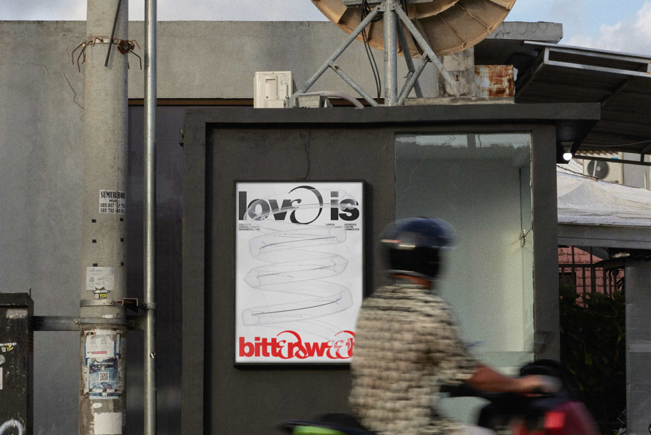 Poster mockup on dark storefront showing love is bitter sweet design