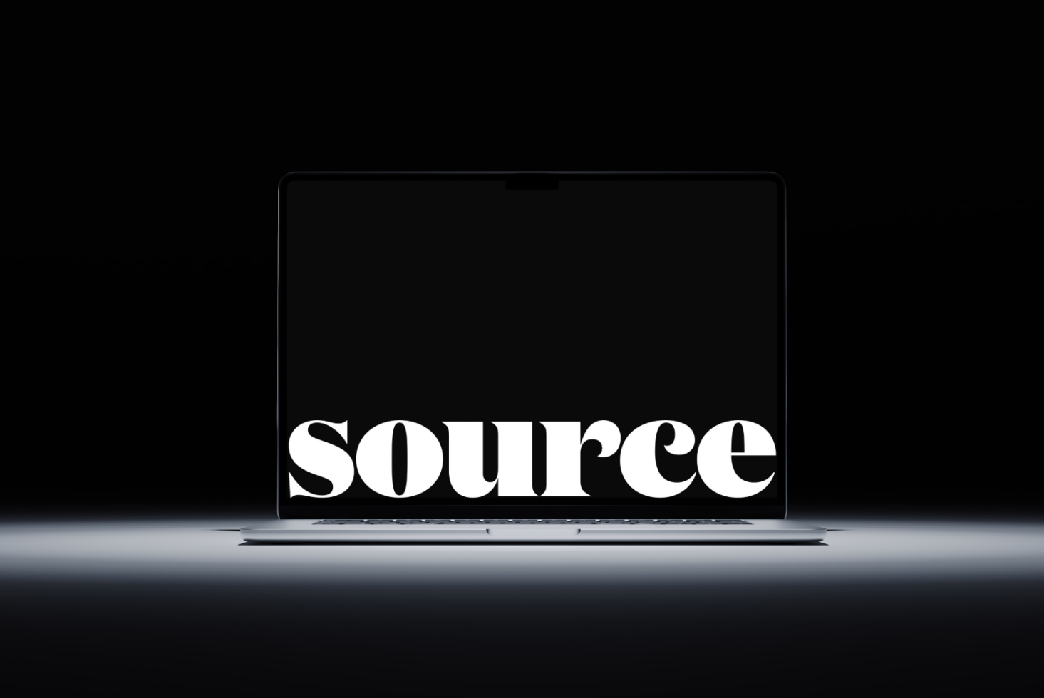Large serif font spelling SOURCE glowing on dark laptop display