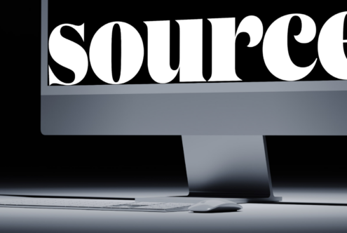 Bold serif type displaying 'source' across desktop monitor screen mockup