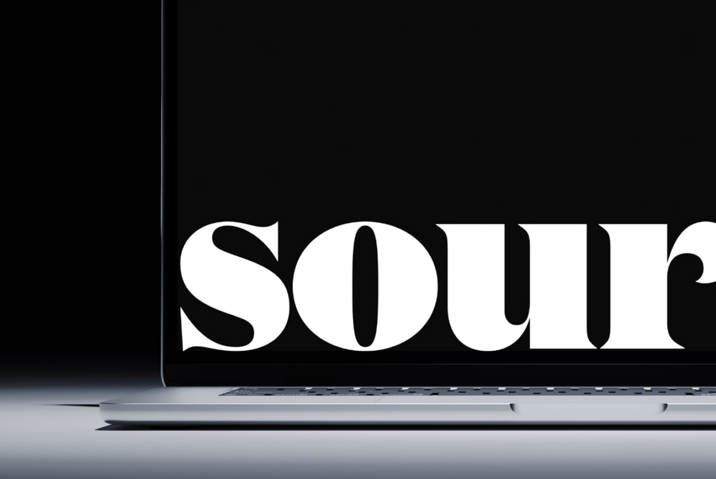 Bold serif type reading SOUTH displayed on laptop screen