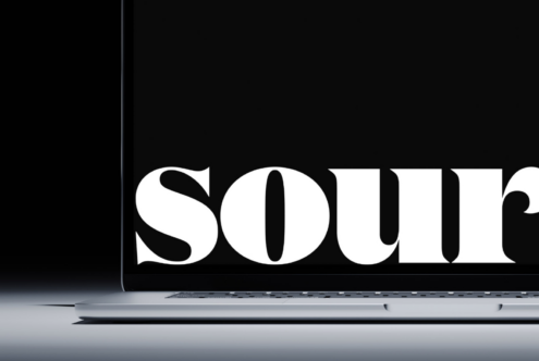 Bold serif type reading SOUTH displayed on laptop screen