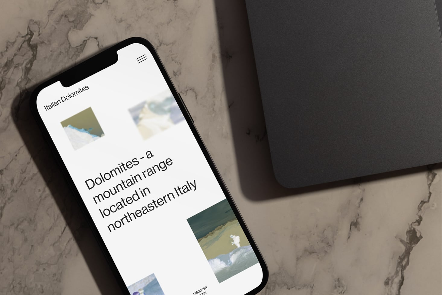 Dolomites mountain range website on phone showing nature photography tiles