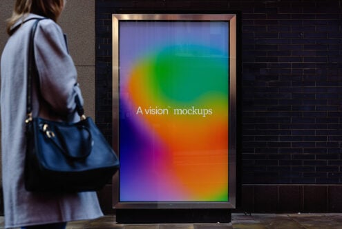 Street display case showing colorful gradient spectrum on lit screen
