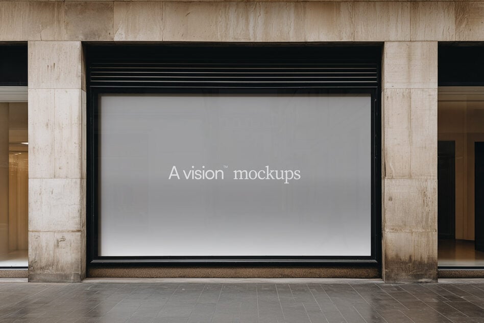 Wide storefront billboard with neutral gray screen showing A vision mockups text