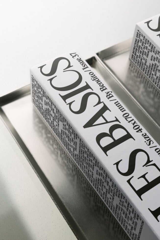 Book spine mockup with large serif typography on cream paper stock