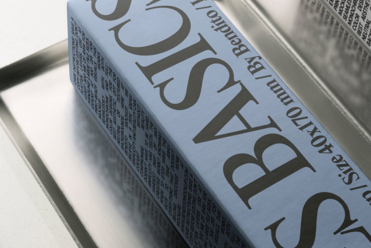 Book spine mockup with large serif typography on light blue paper stock