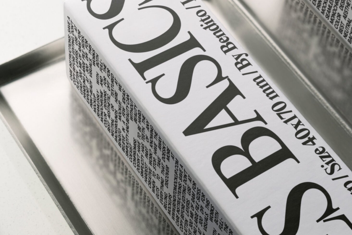 Book spine mockup with large serif typography on cream paper stock