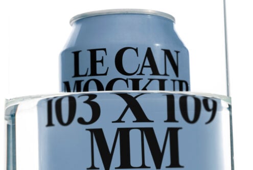 Blue aluminum beverage can mockup sitting in clear glass container