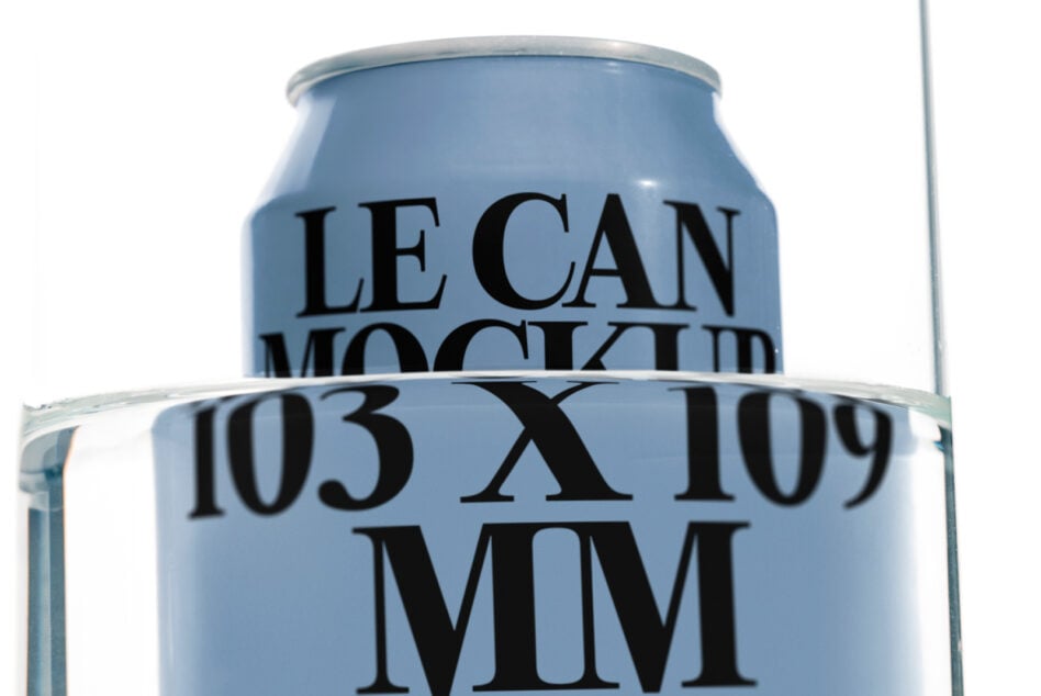 Blue aluminum beverage can mockup sitting in clear glass container