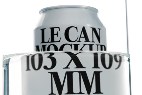 Pale aluminum can mockup positioned in glass with size markers visible