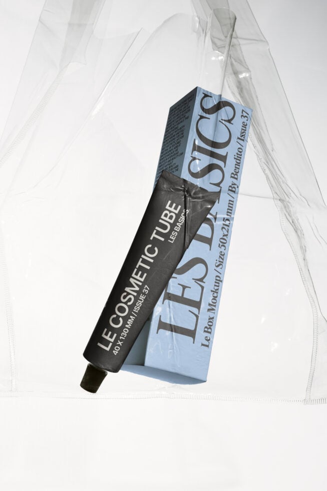 Cosmetic tube mockup in black with sky blue box standing on translucent plastic sheets overhead