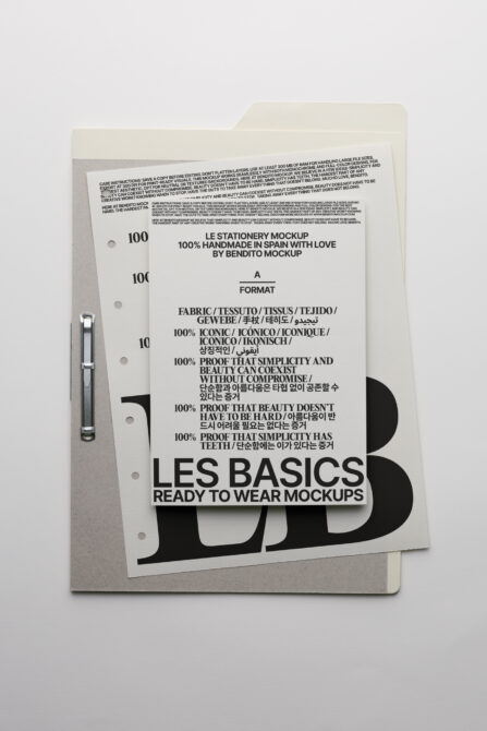 Cream folder with ring binding holding stationery mockup sheet showing Les Basics design
