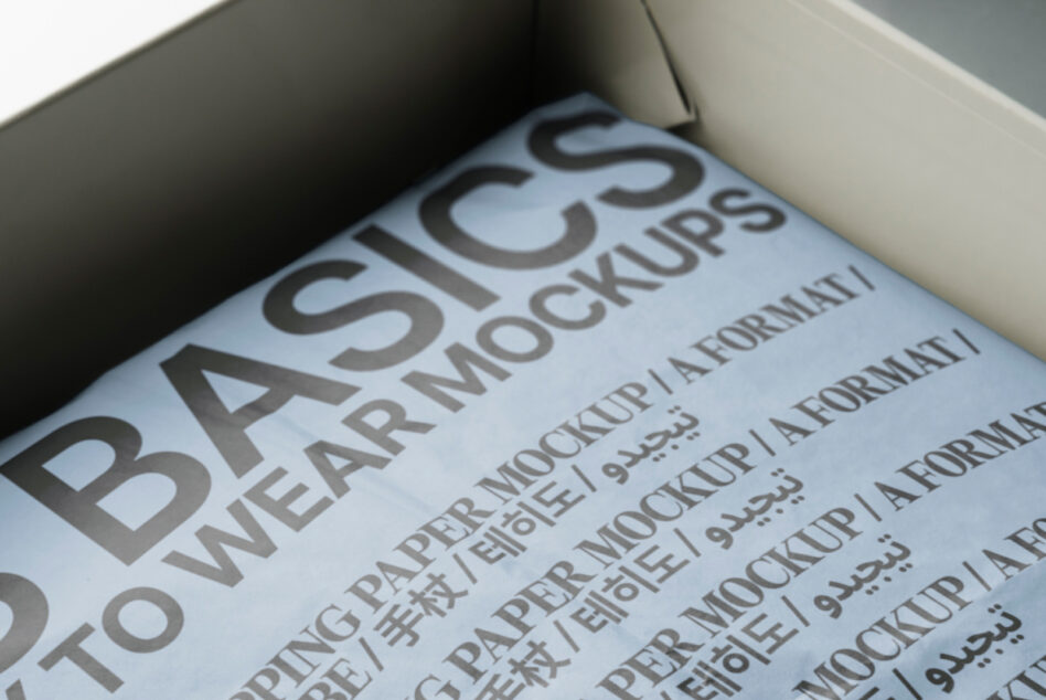 Inside open white box with blue paper mockup showing repeated text layout format
