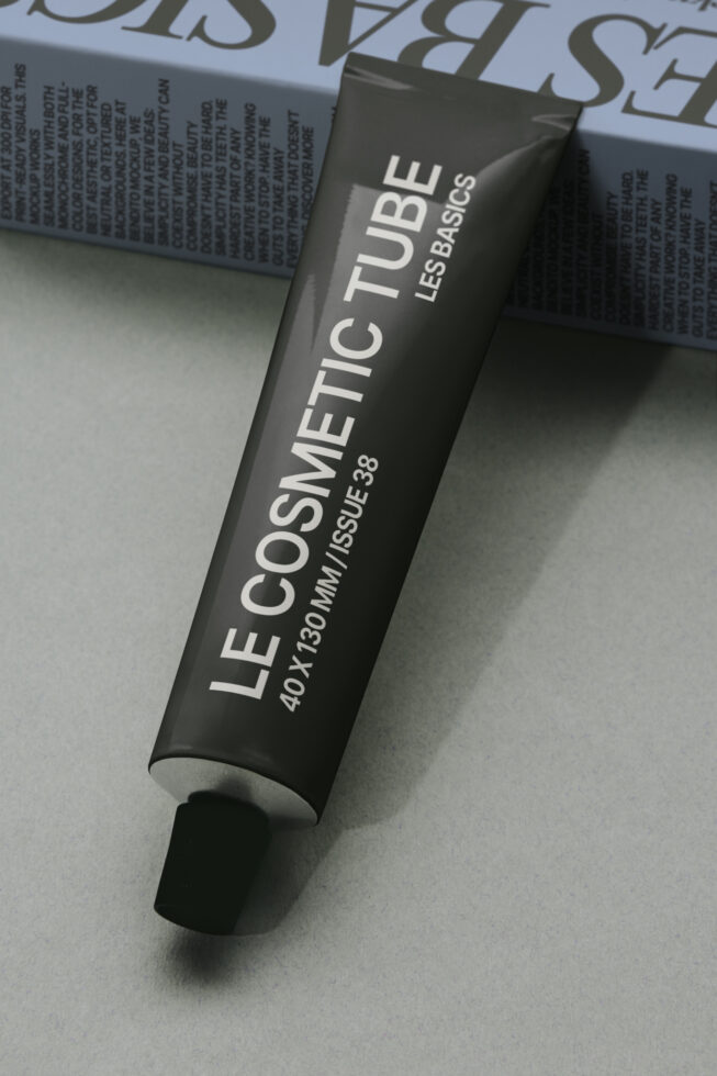 Black cosmetic tube mockup labeled LE COSMETIC TUBE with product text overlay