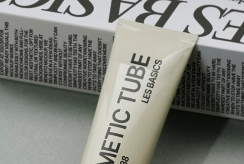 Cream METIC TUBE cosmetic product mockup positioned with printed materials nearby