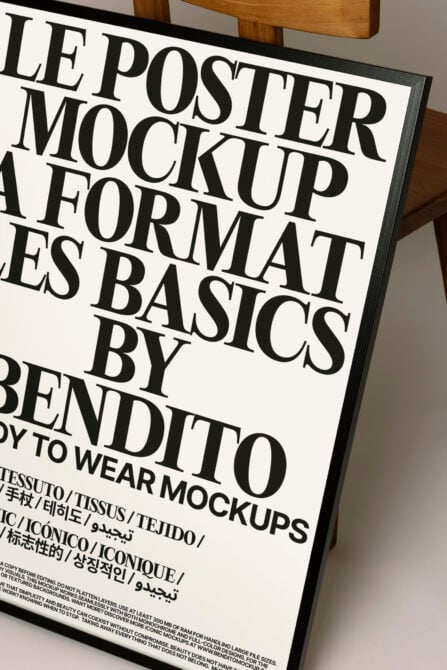 Framed poster mockup with bold serif typography on white background with wood frame