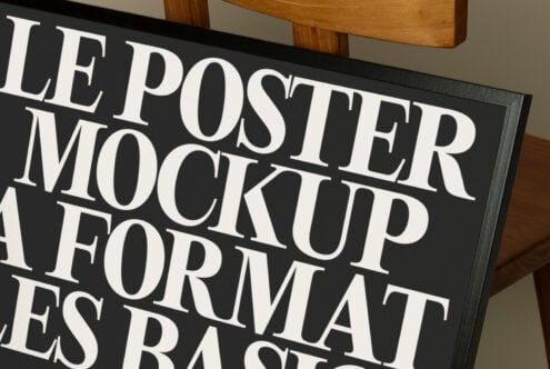 Close-up of dark framed poster mockup showing large serif text against black mat