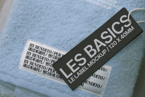 Black woven label mockup on blue folded fabric with text details