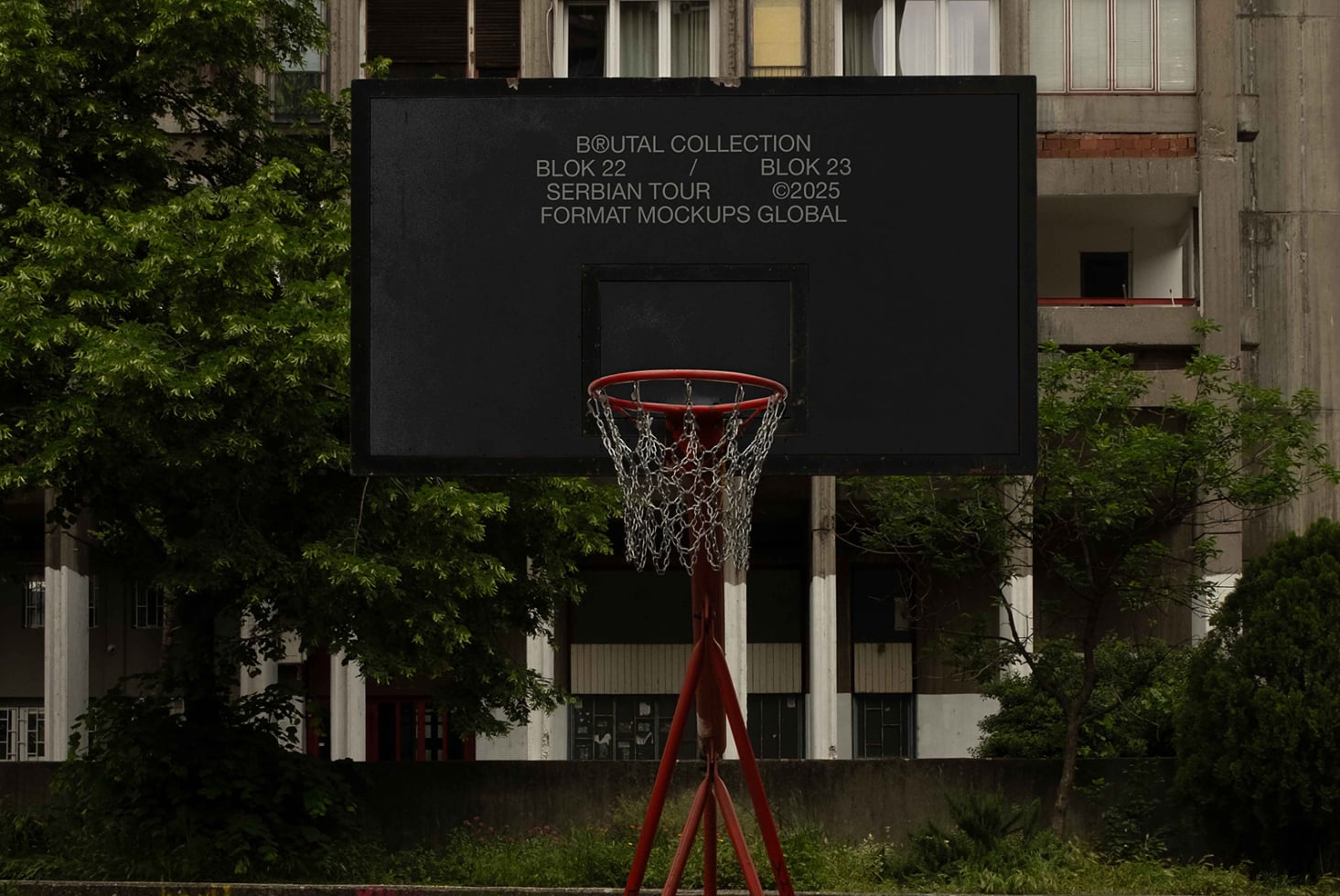 Red basketball hoop with chain net against black backboard displaying Brutal Collection text
