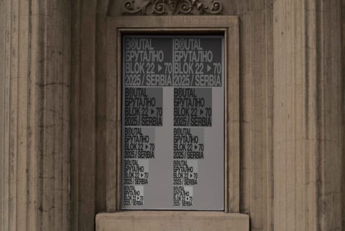 Classical building entrance window with dual column text