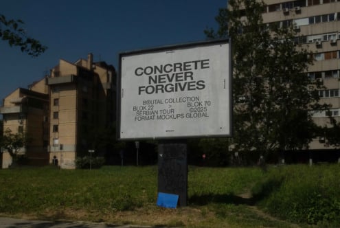 Outdoor billboard mockup with concrete never forgets text on grass
