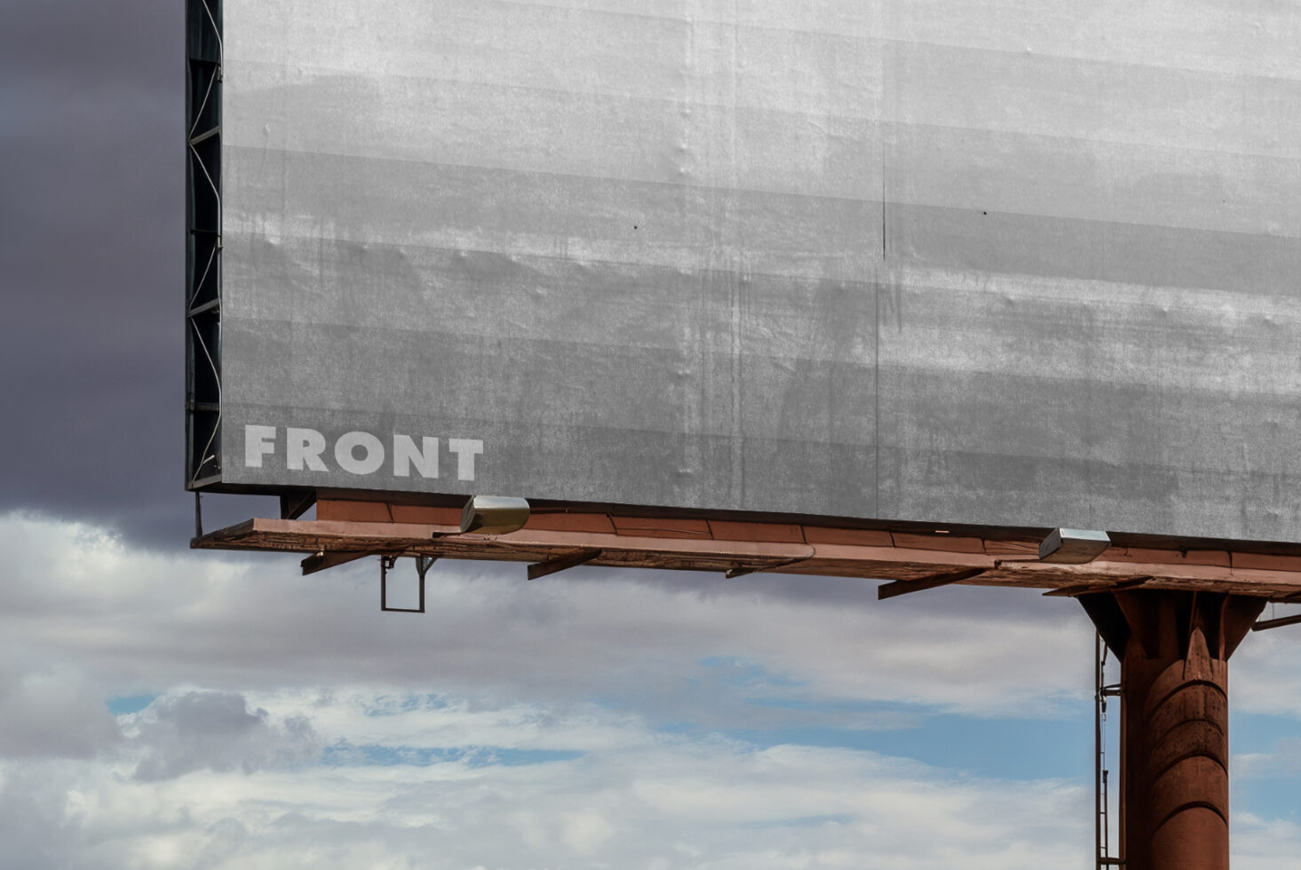 Blank billboard mockup with front label text against cloudy desert landscape